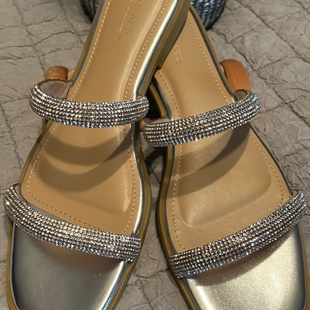 New never worn Just Fab 7.5 flat silver slide ons. Must see to appreciate.